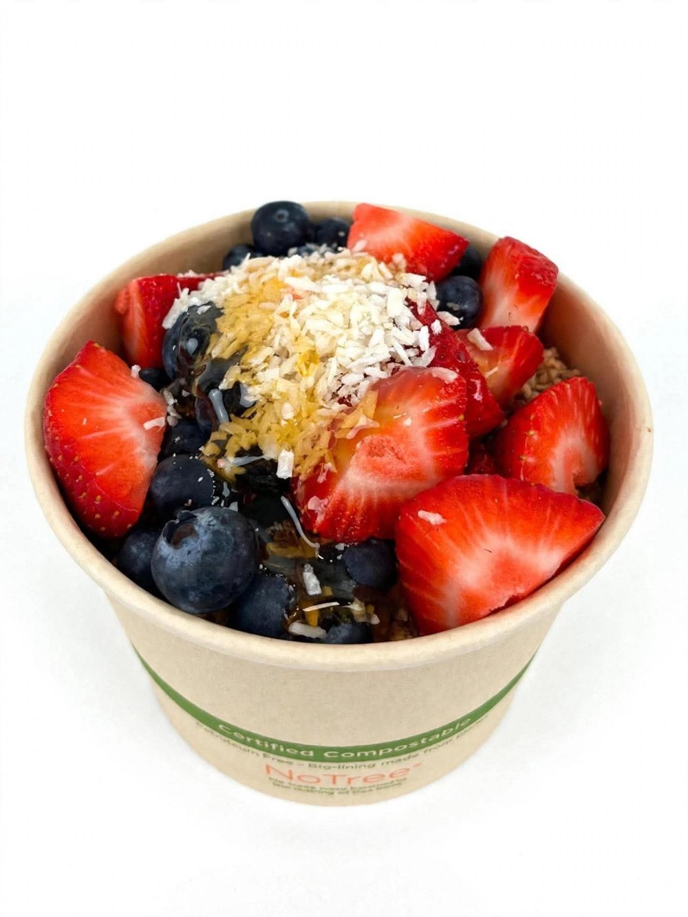 Acai bowl with strawberries, blueberries and coconut